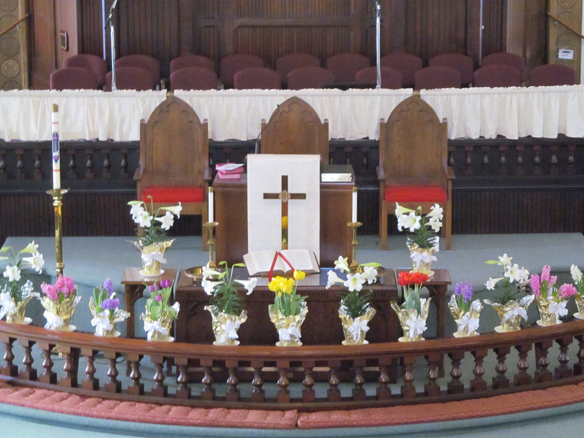 Flowers and the cross at the altar of St. Paul’s sanctuary